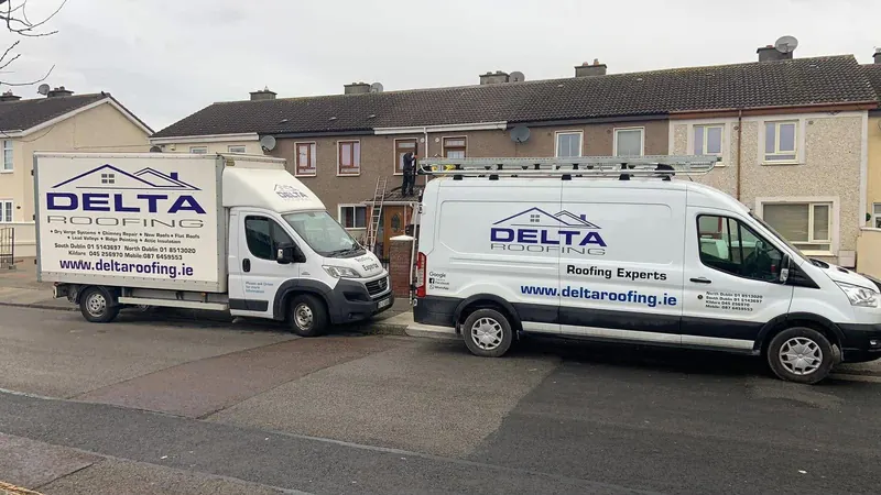 Two vans on the road, Delta Roofing