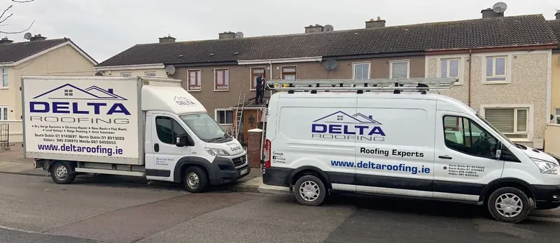 Van outside a terrace, Delta Roofing