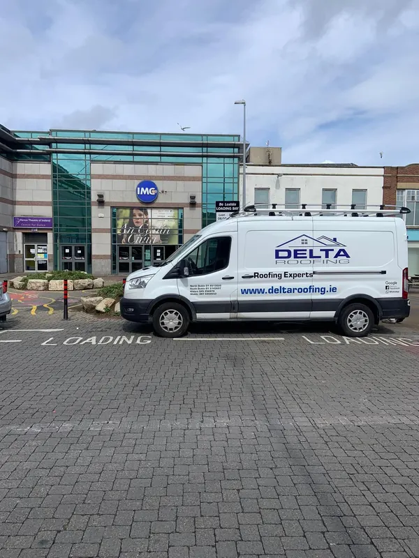 Van outside a commercial job, Delta Roofing
