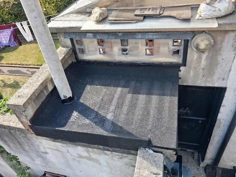 Flat roof stripped, Delta Roofing