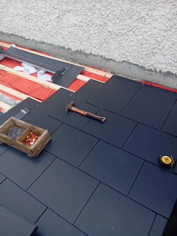 Slate and a rooflight on a flat roof, Delta Roofing