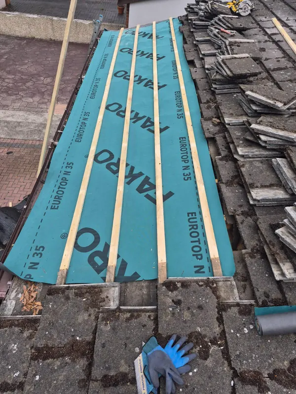 Section of tile lifted and refelted, Delta Roofing
