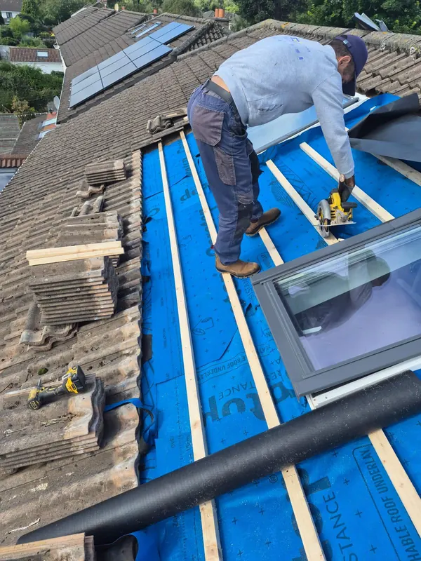 Velux going in on a tiled roof, Delta Roofing