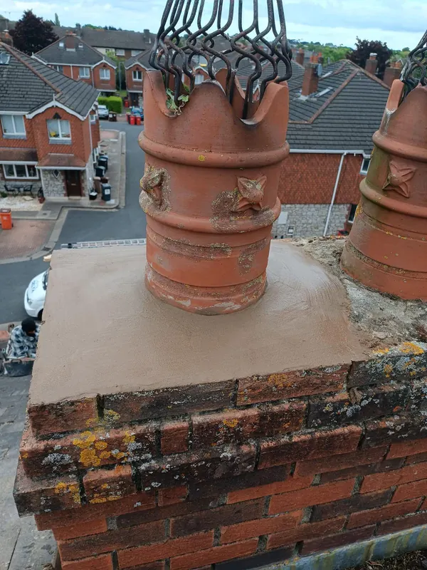 New capping on a redbrick stack, Delta Roofing
