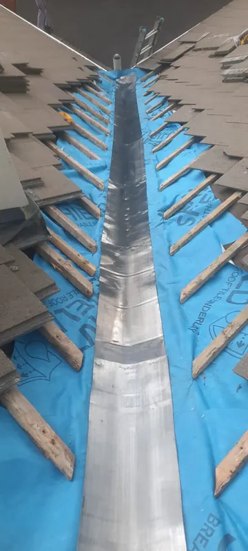 New lead valley, slates going back, Delta Roofing